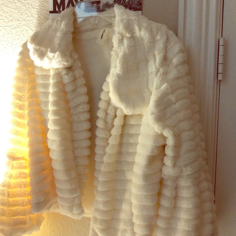 furry cream colored shawl